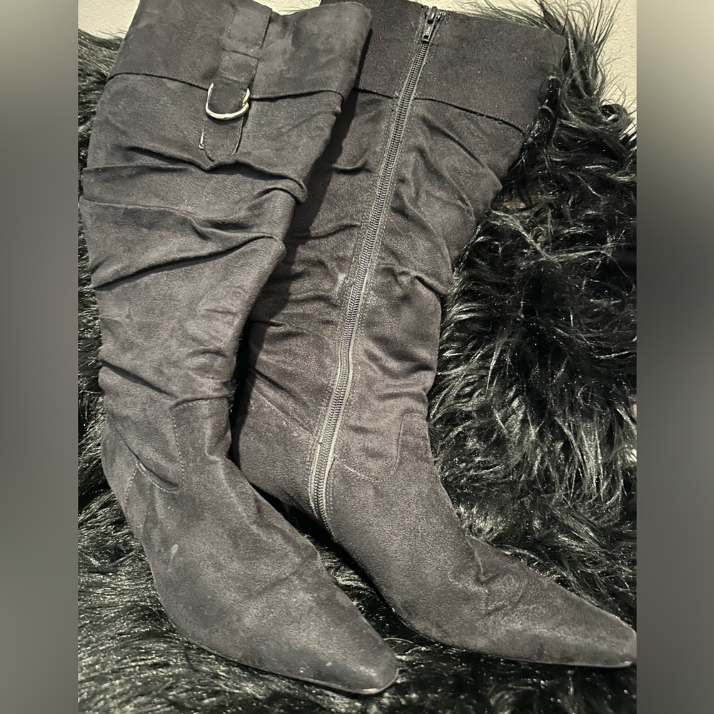 Faux suede black heeled boots.